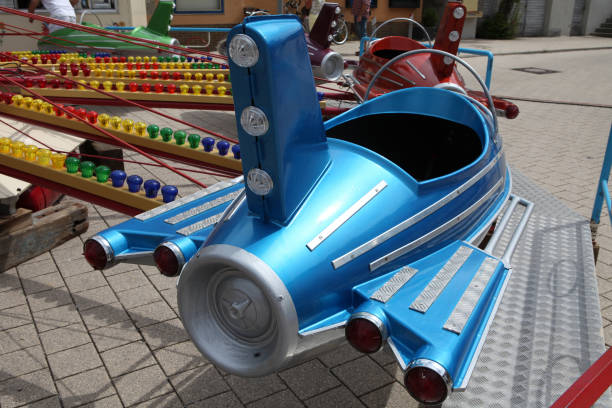 Blue retro toy airplane in a merry-go-round or carousel