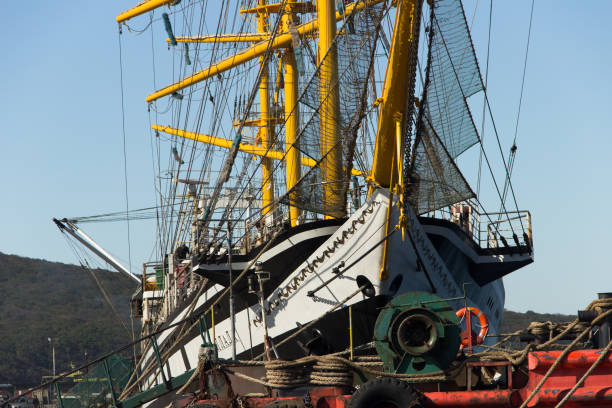 sailboat frigate "pallada" in the port of vladivostok is preparing to go around the world, dedicated to the 200th anniversary of the discovery of antarctica. - sailing ship nautical vessel rigging industrial ship imagens e fotografias de stock