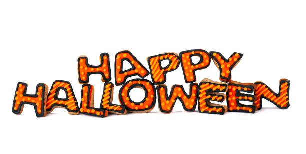 istock Happy Halloween with gingerbread handmade cookies isolated on white background 1282379070