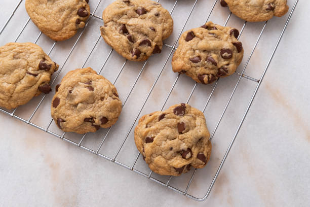 istock Freshly baked chocolate chip cookies cooling on the counter 1282383233