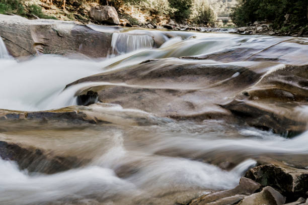istock Waterfall with blurry water because it was photographed at long shutter speed. Waterfall in the mountain river with big rocks. Travelling in quarantine period. Nature landscape. Karpathians mountains 1282388550