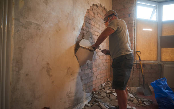 istock Taking the old plaster off the wall 1282389465