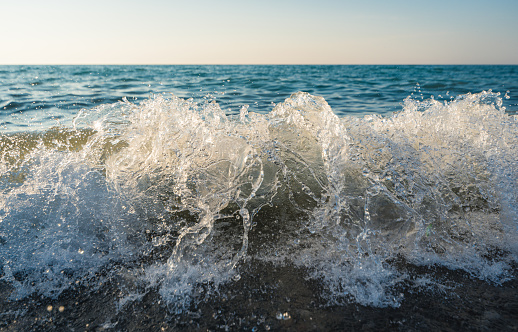 Waves on a Lake Huron beach come directly at the camera