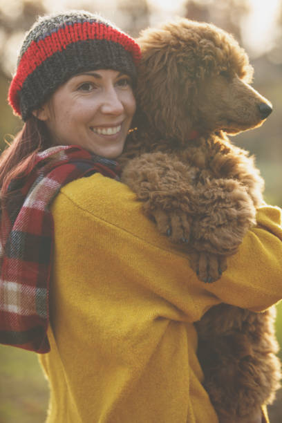 istock Soaking all the love and affection while cuddling with her dog 1282395202