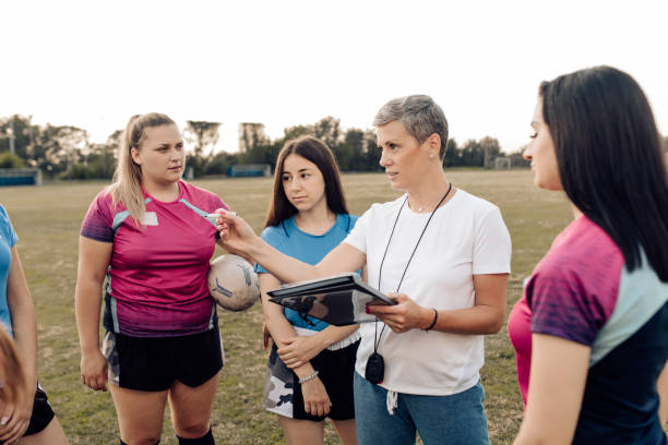 istock Female rugby coach making a play strategy before the game 1282395312