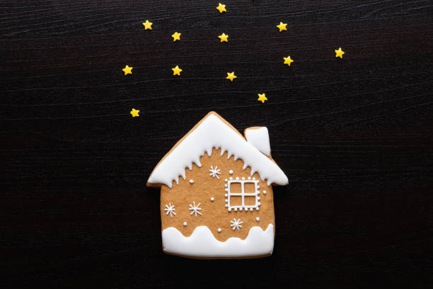 istock christmas night black festive art background house 1282396083