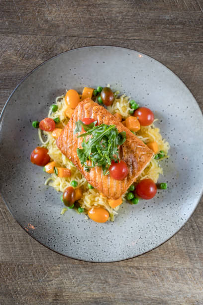 istock Salmon and Tomato served over Rice 1282400187