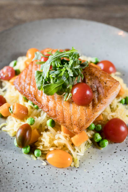 istock Grilled salmon served over rice in Restauran 1282400191