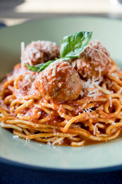 istock spaghetti and meatballs served in Italian Restaurant 1282400589