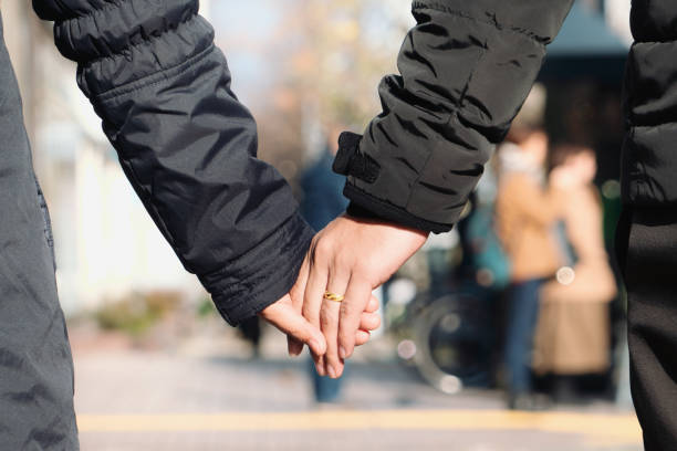 istock Couples holding hands in the winter season 1282400966