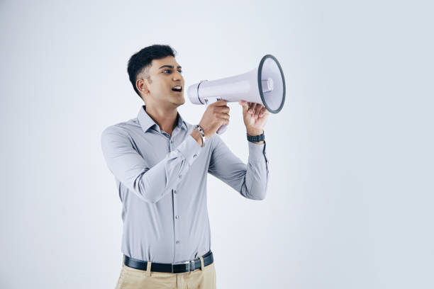 istock Businessman shouting in loud speaker 1282402840