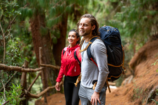 istock wedding couple walks through the woods 1282408554