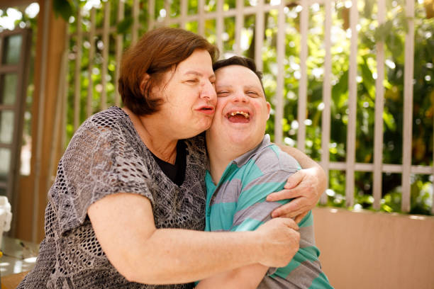 istock Mother hugging her son with special down syndrome 1282410870