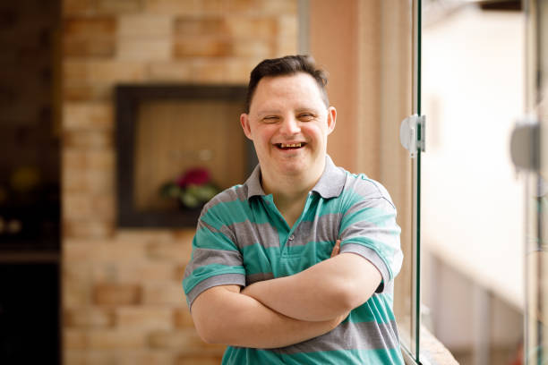 Portrait of a man with special needs Man with special needs down syndrome stock pictures, royalty-free photos & images