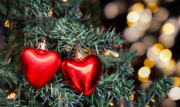 istock the two red hearts on the christmas tree 1282414333