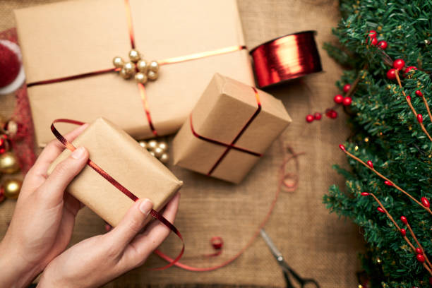 istock woman hands preparing christmas gift present boxes 1282414368