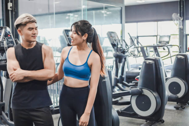 istock Asian couples posting post a photo with camera so exercise before running on the treadmill.Athletic exercises.Metaphor Fitness and workout concept exercise Health lifestyle muscle body of your health 1282417840