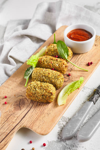 istock Cheese sticks on wooden plate with red sauce 1282421949