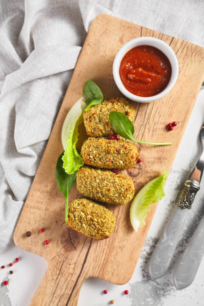 istock Cheese sticks on wooden plate with red sauce 1282421963