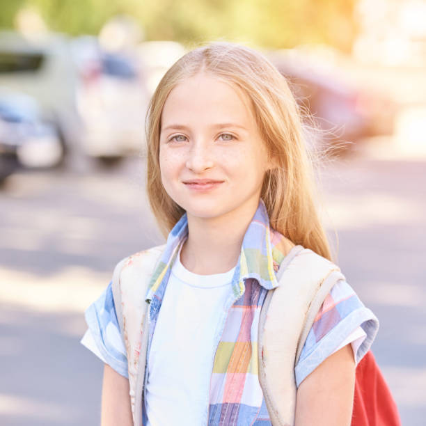 istock Young school girl with backpack. Lifestyle going to classroom 1282426682