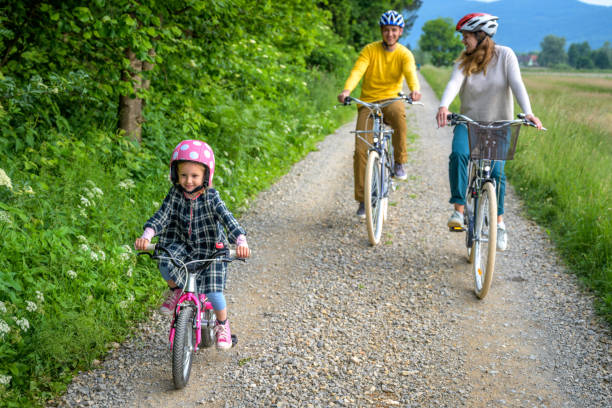 istock Young active Caucasian family riding bicycles. 1282426733