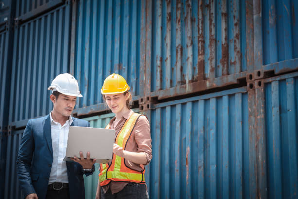 istock Container Shipping Logistics Engineering of Import/Export Transportation Industry, Transport Engineers Teamwork Controlling Management Containers Together at Port Ship Loading Dock. Business Team 1282427645