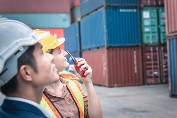 istock Container Shipping Logistics Engineering of Import/Export Transportation Industry, Transport Engineers Teamwork Controlling Management Containers Together at Port Ship Loading Dock. Business Team 1282428406