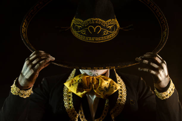 mexican charro holding his hat mexican charro holding his hat day of the dead photos stock pictures, royalty-free photos & images