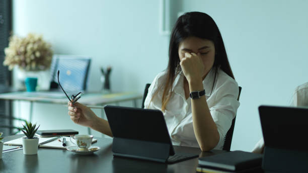istock Female entrepreneur feeling stressed while working in office room 1282428710