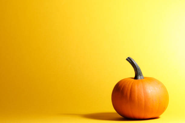 istock Halloween pumpkin on yellow 1282430796
