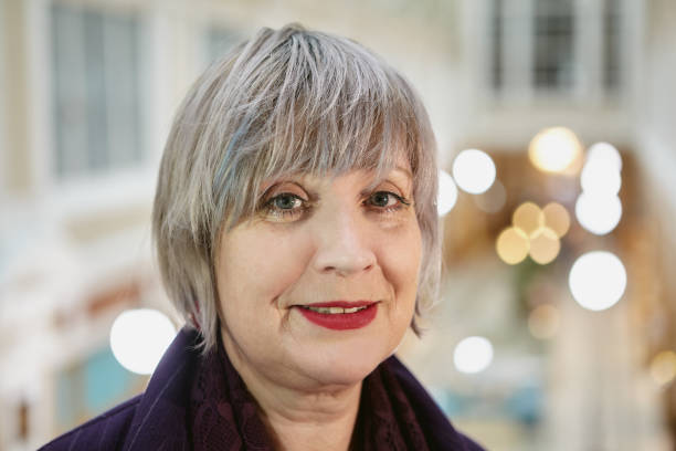 istock Cheerful aged lady's portrait outside. 1282432479