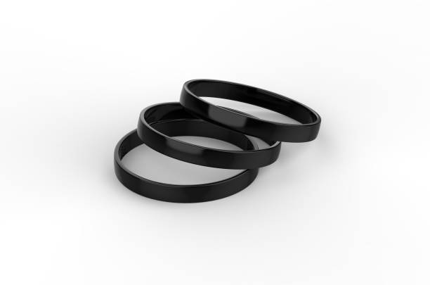 Macro image of two wedding rings isolated on black leather background. Top down view.