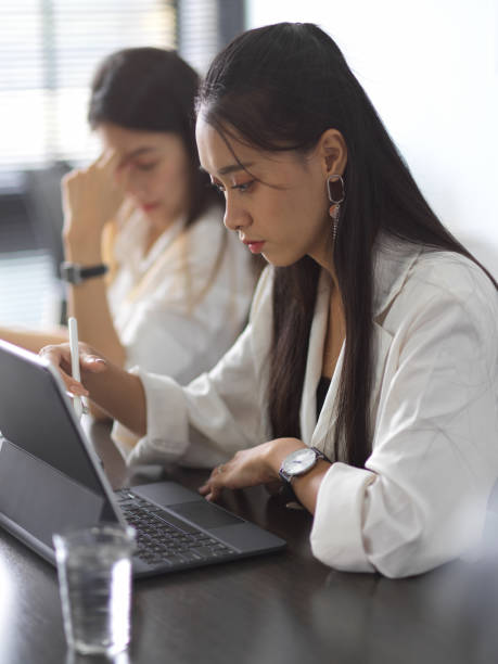 istock Businesswomen team working on their project together in office room 1282436766