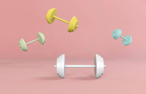 istock 3d pastel colored dumbbells on pink background. Sport workout concept. 1282439588