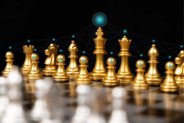 istock Chess game on a black background with business strategy planning ideas and connect for successful business information concepts. 1282439705