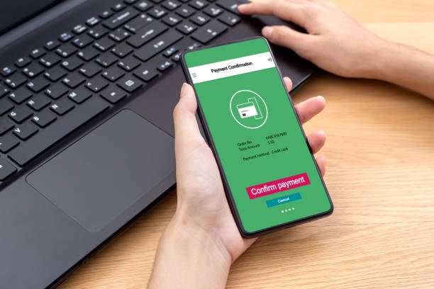 istock Female using mobile smart phone online confirm payment for online shopping mobile payment. Concept banking and online shopping mobile payment. 1282440881