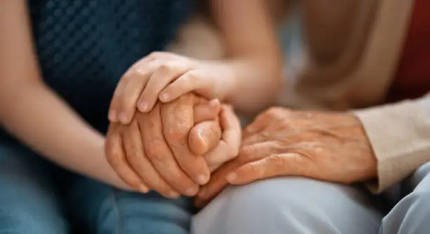 Photo of Granddaughter supporting her grandmother