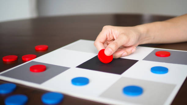 istock people playing tic tac toe board game strategy on wooden table top selected focus 1282443477