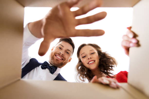 istock happy couple opening christmas gift box 1282444027
