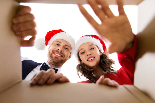 istock happy couple opening christmas gift box 1282444139