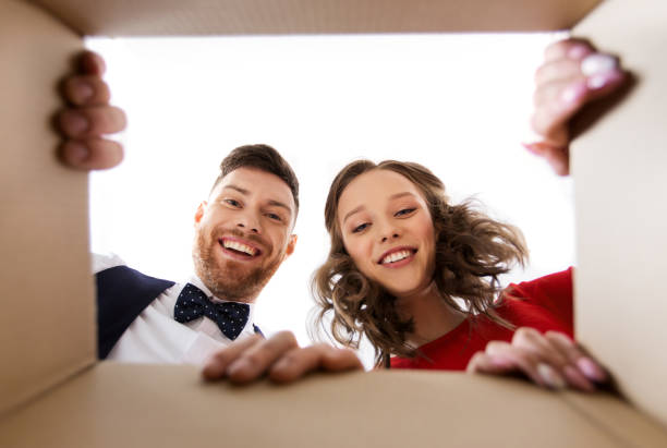 istock happy couple opening christmas gift box 1282444234