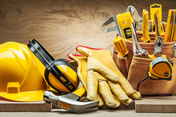 istock helmet earphones hammer gloves and toolbelt with construction tools 1282447722