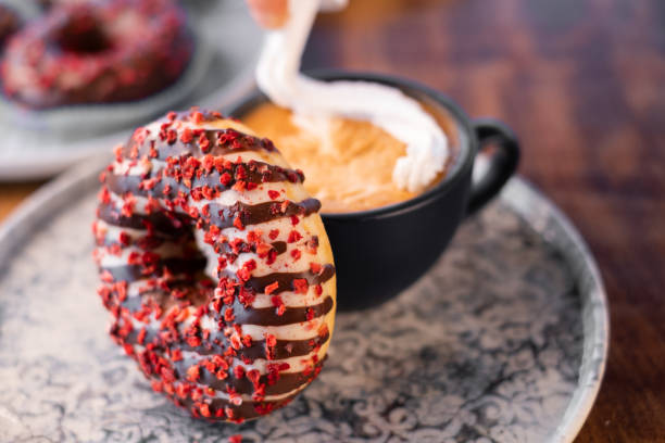 istock Colorful Donuts with whipped cream coffee 1282447989