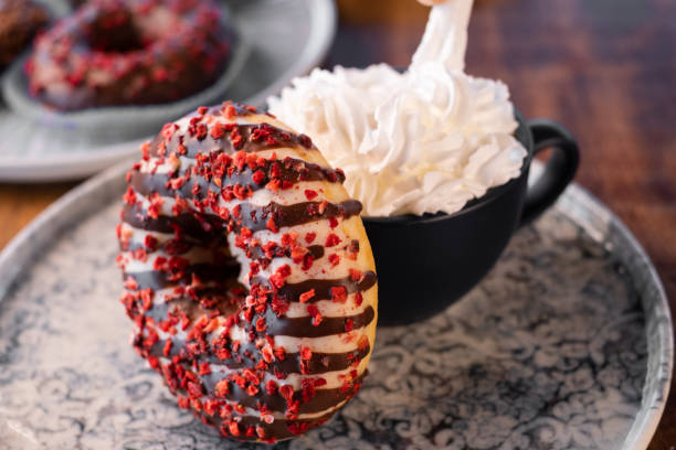 istock Colorful Donuts with whipped cream coffee 1282448033
