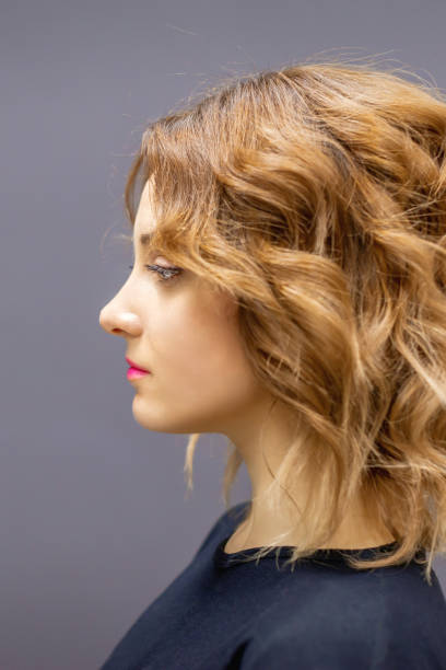 istock Woman with red long wavy hairstyle 1282448079