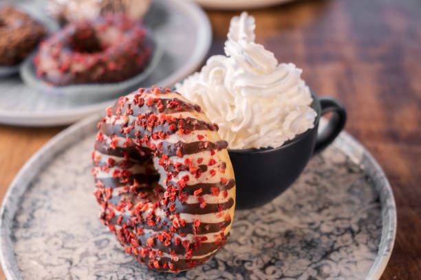 istock Colorful Donuts with whipped cream drink 1282448201