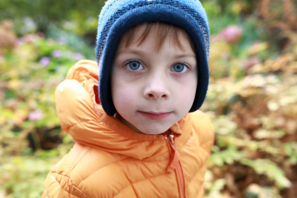 istock Child in autumn park 1282452736
