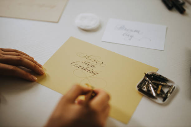 istock Never stop learning, calligraphy. Close-up image of woman writing cali 1282454153