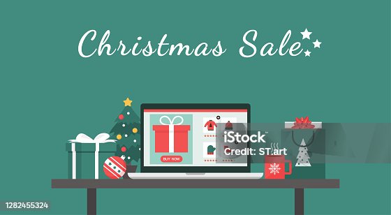 istock Christmas sale online shopping concept on a laptop screen on table with text 1282455324