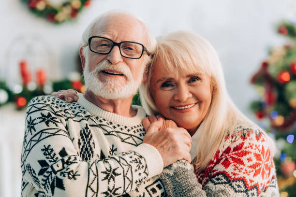 istock happy senior couple embracing while smiling at camera 1282456129